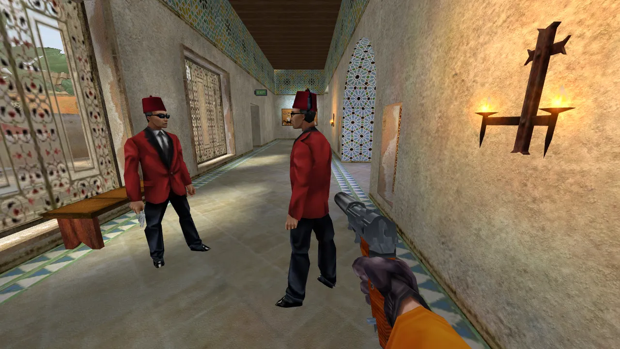 The same corridor in the final picture: tiled walls, two agents in red jackets and fezzes, torches on the wall